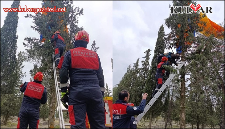 Denizli’de ağaçta asılı kalan yamaç paraşütçüyü itfaiye kurtardı